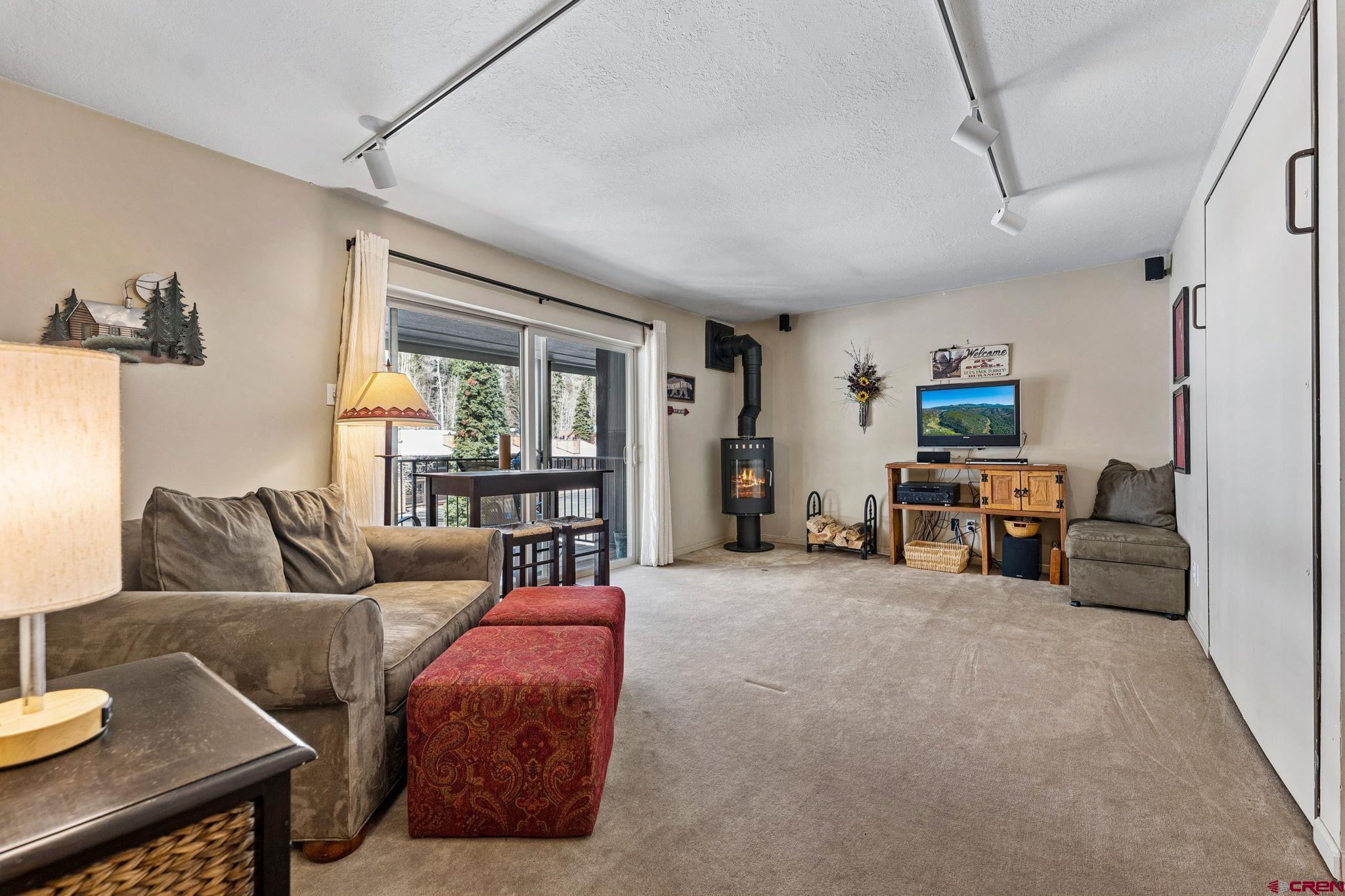 395 Sheol Street, Unit 117 Durango, CO 81301 - Photo 3 of 28 a living room with furniture and a couch