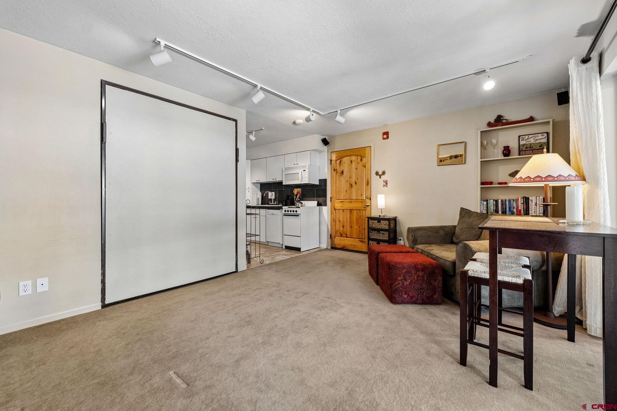 395 Sheol Street, Unit 117 Durango, CO 81301 - Photo 7 of 28 a livingroom with furniture and a stove