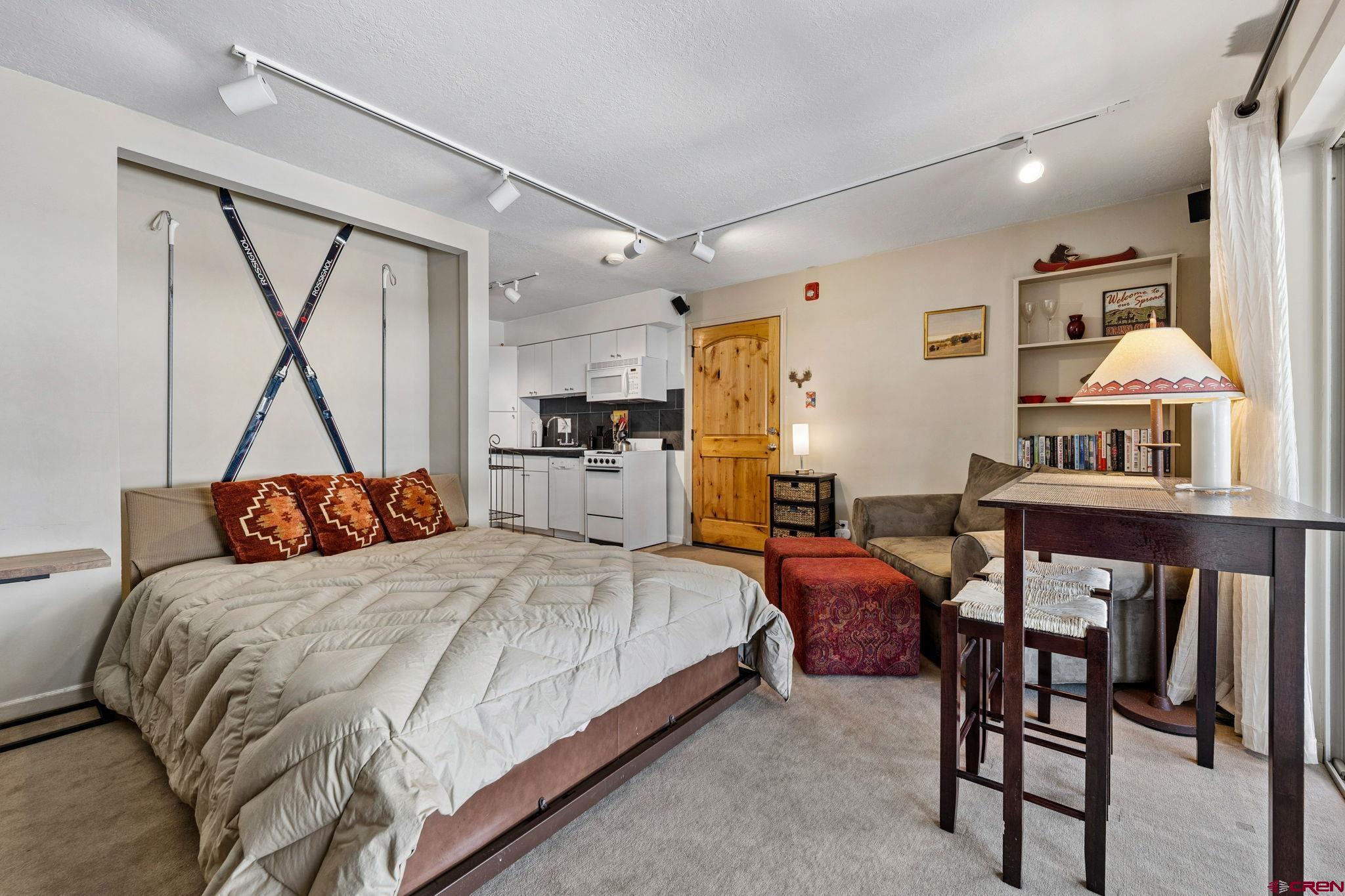 395 Sheol Street, Unit 117 Durango, CO 81301 - Photo 9 of 28 a bedroom with a bed and a table