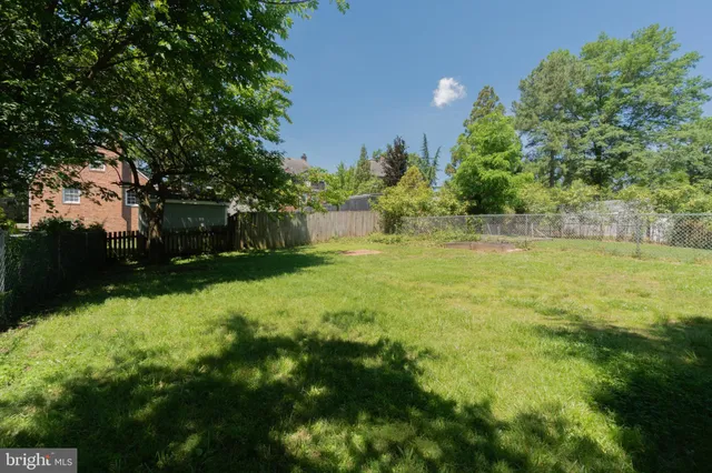 a view of a house with a yard porch and sitting area