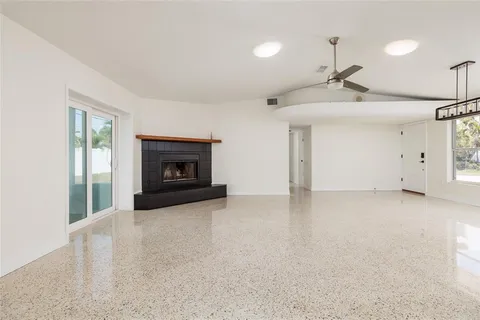 a view of an empty room with a fireplace