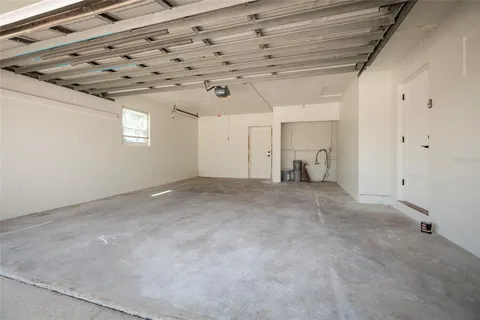 a view of a livingroom with a white wall and a window