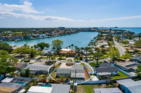an aerial view of a house with a lake view