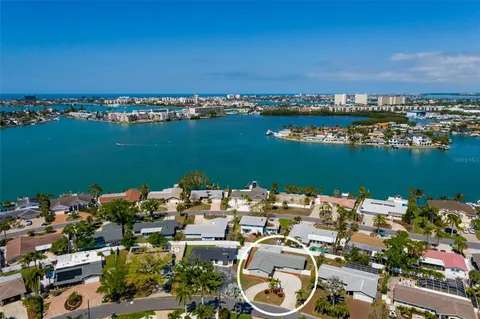 an aerial view of a house with a ocean view