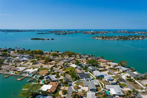 an aerial view of a house with a lake view