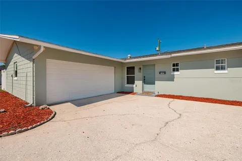 a backyard of a house with yard and garage