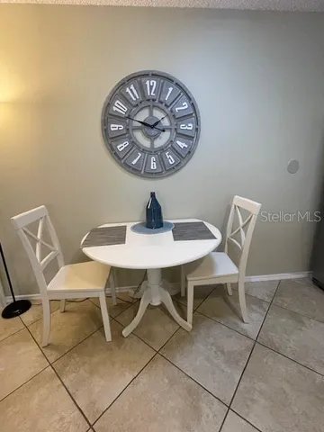 a view of a table and chairs in a room