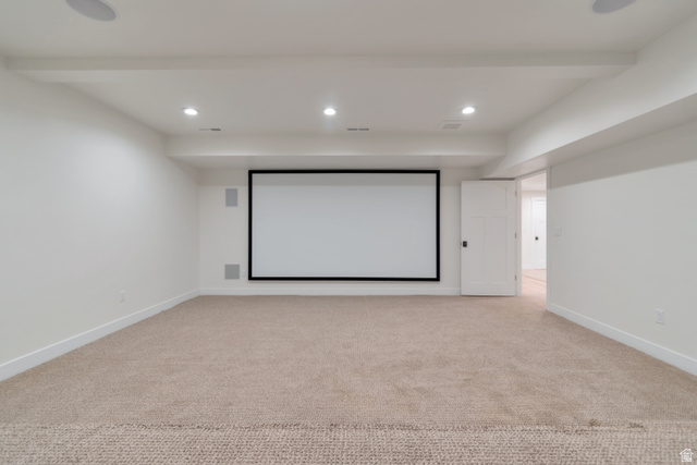 1820 West Farmhouse Flats Road Peoa, UT 84061 - Photo 42 of 79 Spacious entertainment area featuring a large projection screen, integrated ceiling speakers, recessed lighting, and soft carpet flooring