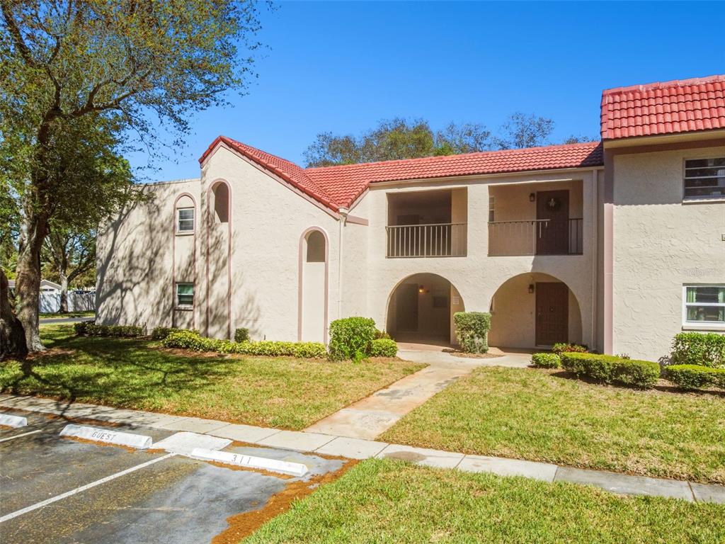 a view of a house with a yard