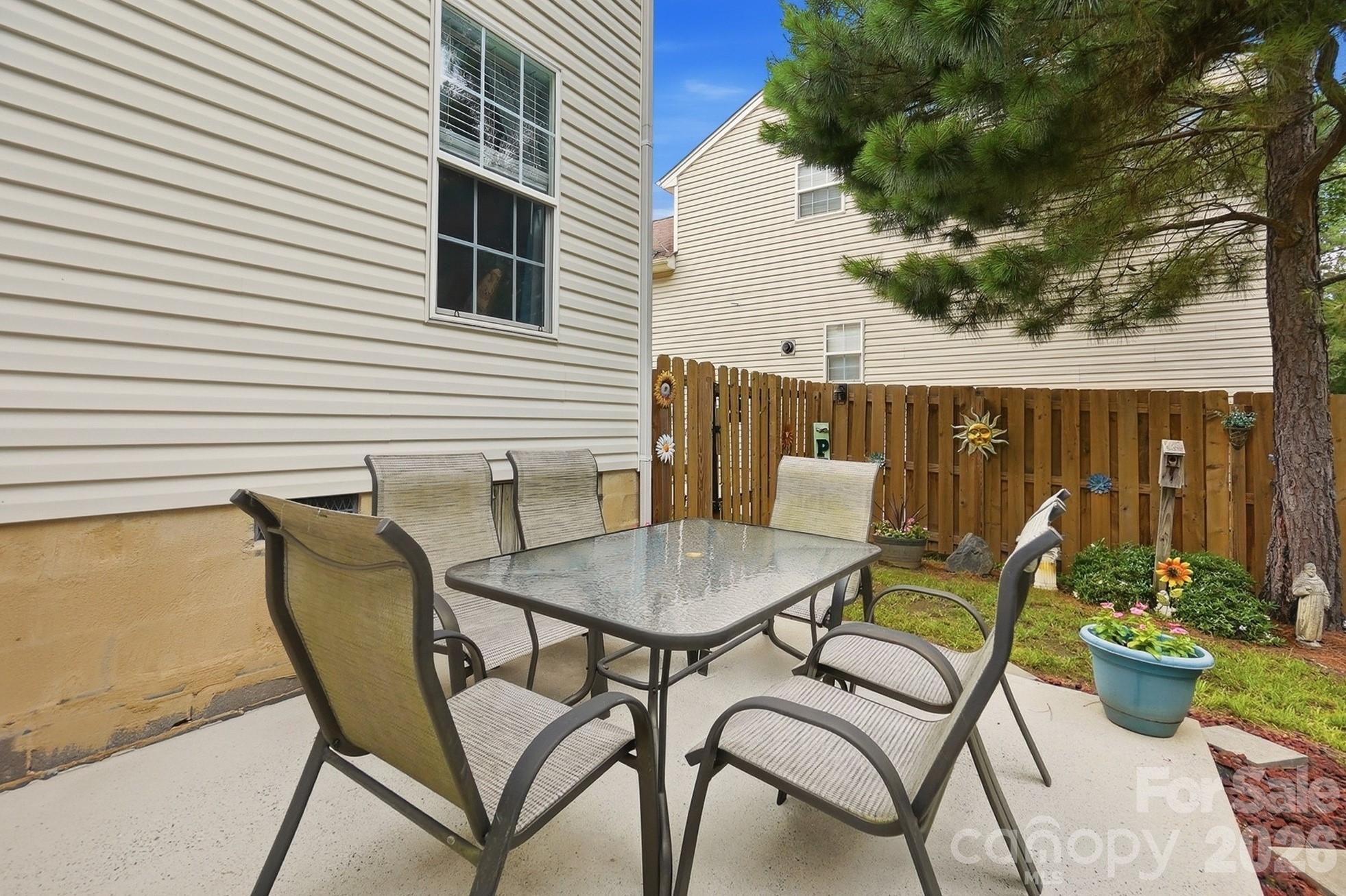 442 Sugar Maple Drive Tega Cay, SC 29708 - Photo 34 of 48 a view of a chairs and table in patio