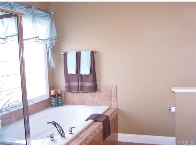 524 Elan Hall Road Cary, NC 27519 - Photo 16 of 25 Clean and elegant Master Bath with beautiful tile and custom drapery Master Bath/Spa