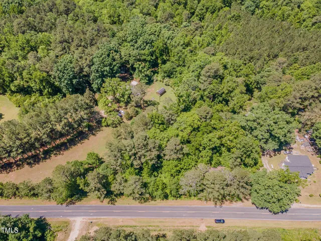 a view of a yard with a tree