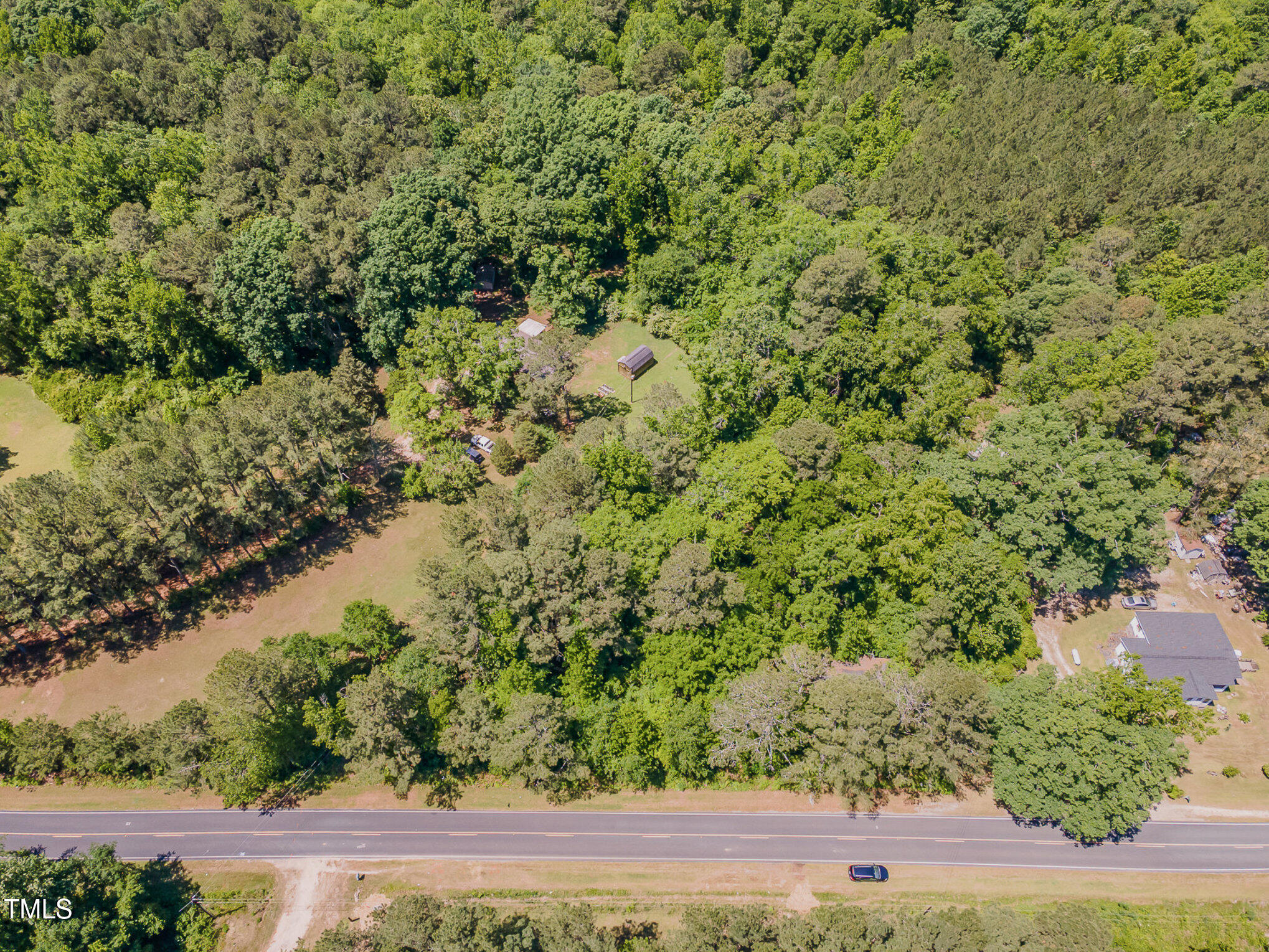 1510 Walker Road Linden, NC 28356 - Photo 4 of 8 a view of a yard with a tree