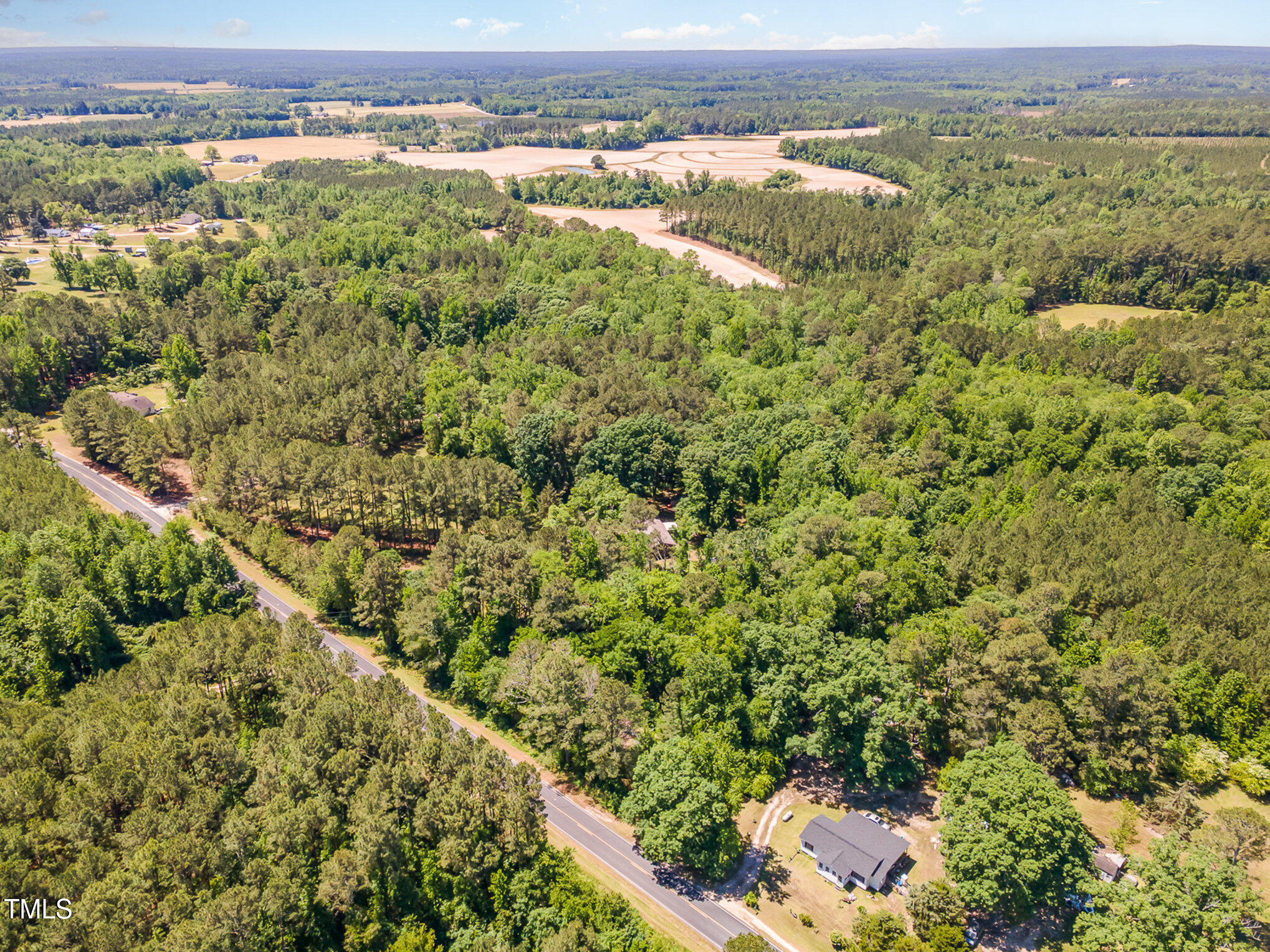 1510 Walker Road Linden, NC 28356 - Photo 6 of 8 an aerial view of residential houses with outdoor space and trees