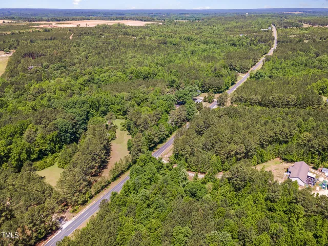 a view of a field with an ocean view