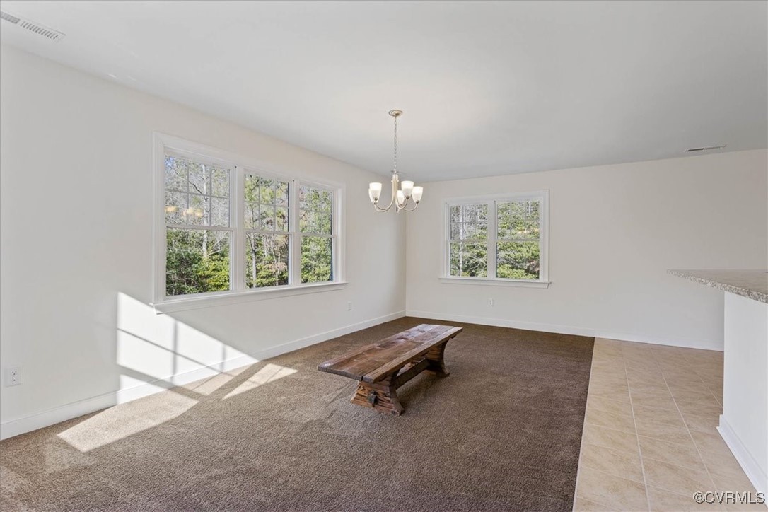 4086 Newville Road Waverly, VA 23890 - Photo 13 of 45 Unfurnished dining area featuring light tile patte