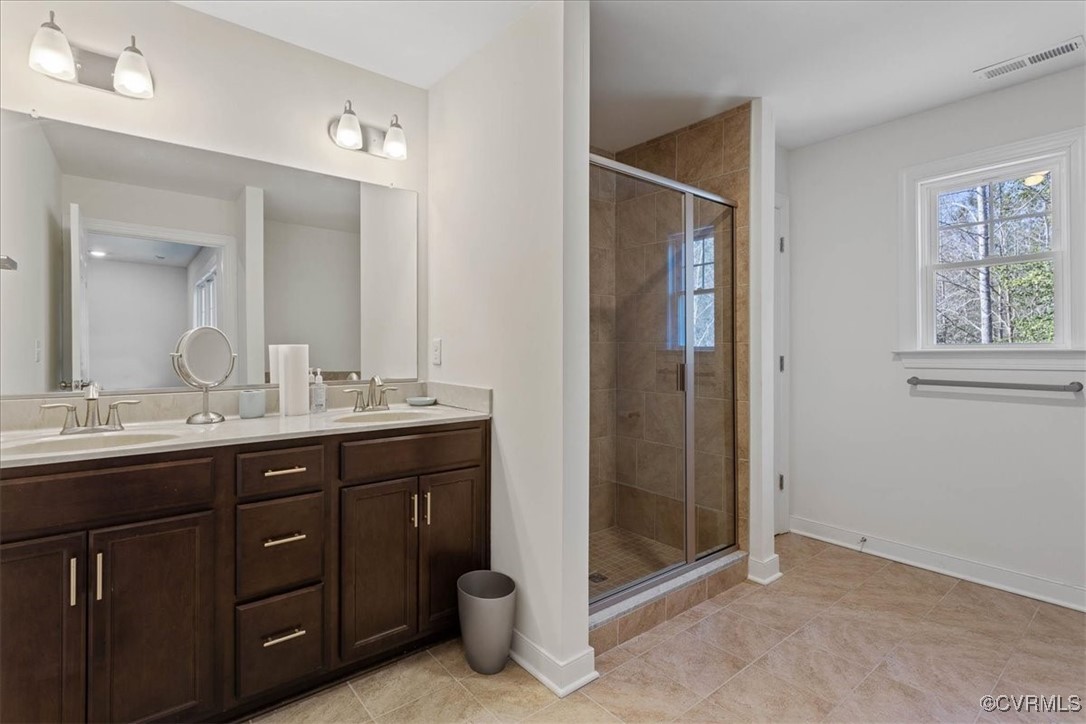 4086 Newville Road Waverly, VA 23890 - Photo 20 of 45 Bathroom with vanity, tile patterned flooring, and