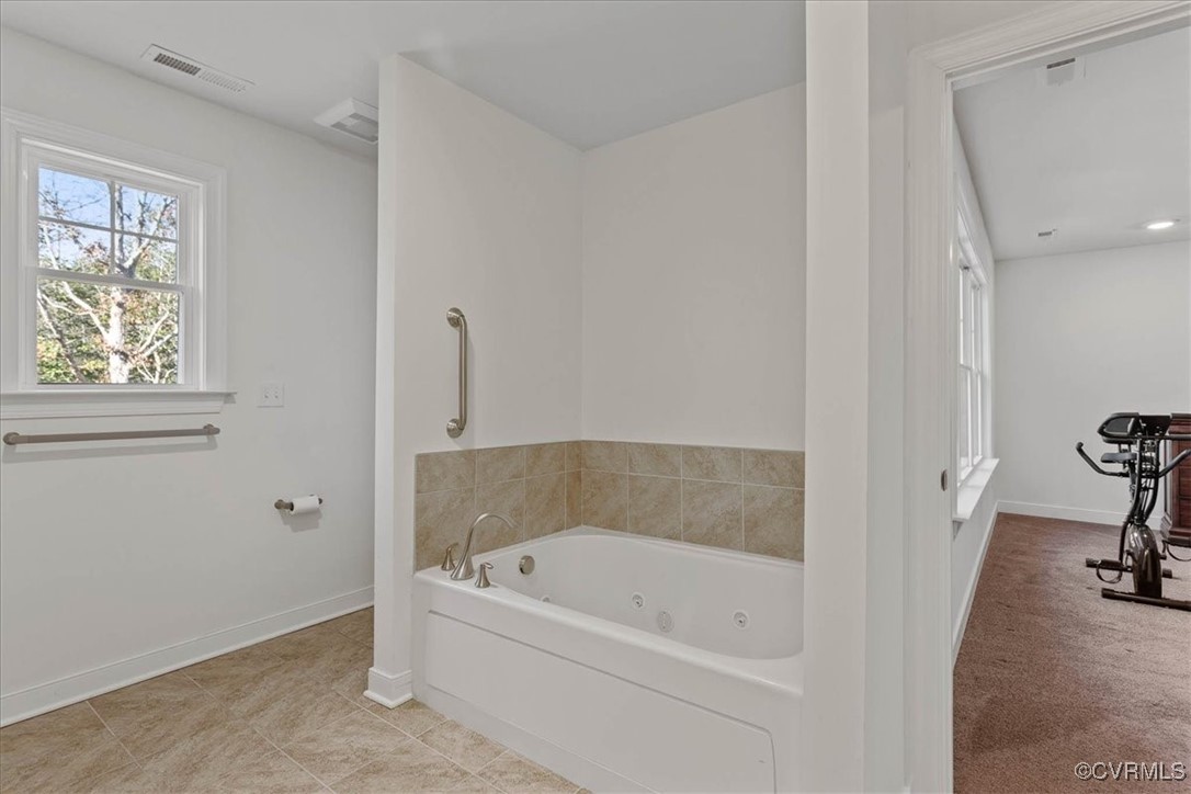 4086 Newville Road Waverly, VA 23890 - Photo 21 of 45 Bathroom featuring a tub and tile patterned floors