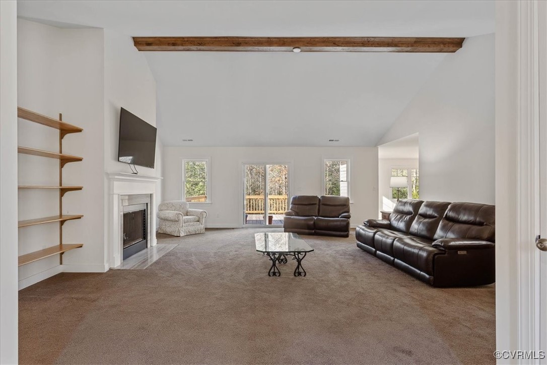 4086 Newville Road Waverly, VA 23890 - Photo 5 of 45 Carpeted living room featuring beamed ceiling and