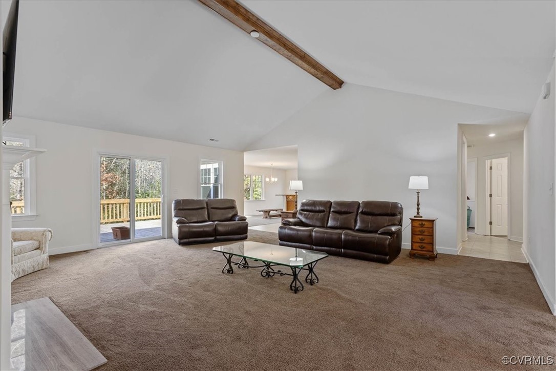 4086 Newville Road Waverly, VA 23890 - Photo 6 of 45 Living room with beamed ceiling, high vaulted ceil