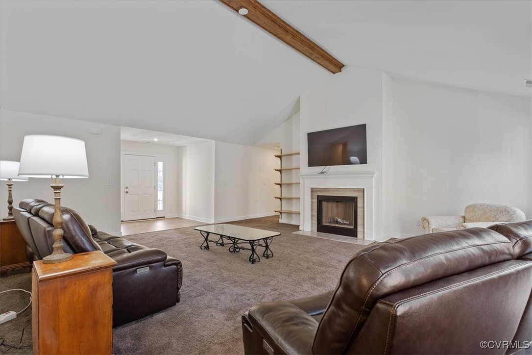 4086 Newville Road Waverly, VA 23890 - Photo 8 of 45 Carpeted living room featuring beamed ceiling, a f