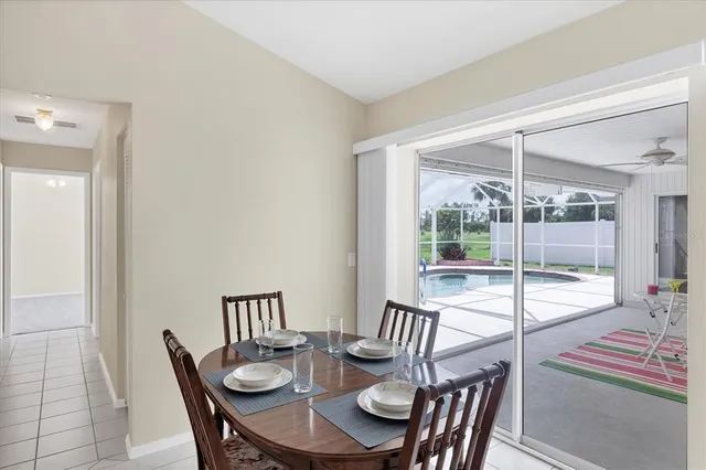 a living room with furniture and view of kitchen