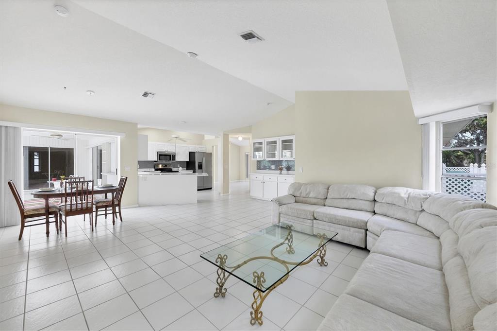 63 Clubhouse Road Rotonda West, FL 33947 - Photo 12 of 44 a living room with furniture and view of kitchen