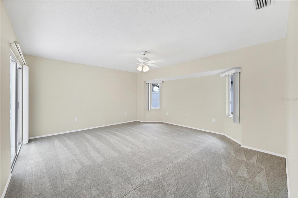 63 Clubhouse Road Rotonda West, FL 33947 - Photo 14 of 44 a view of an empty room with a window