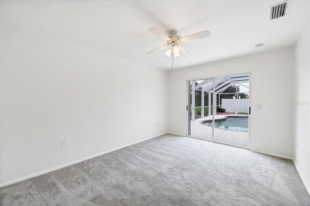63 Clubhouse Road Rotonda West, FL 33947 - Photo 19 of 44 wooden floor in an empty room