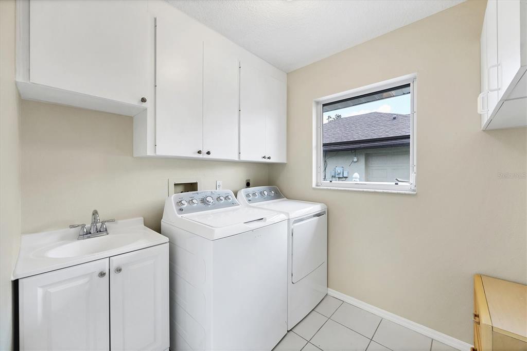 63 Clubhouse Road Rotonda West, FL 33947 - Photo 25 of 44 a utility room with dryer and washer