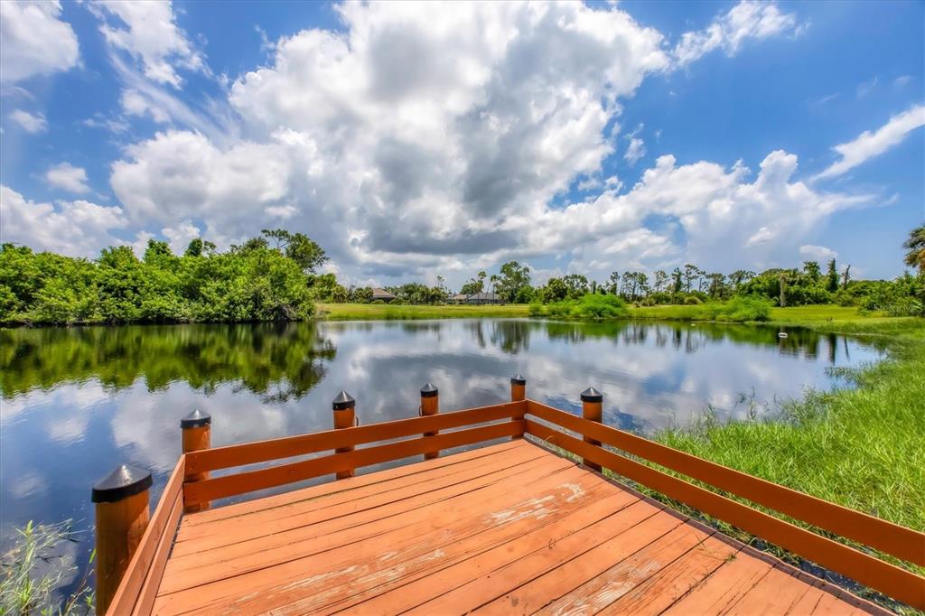 63 Clubhouse Road Rotonda West, FL 33947 - Photo 36 of 44 a view of a lake