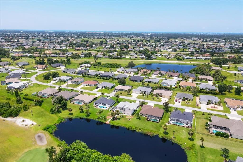 63 Clubhouse Road Rotonda West, FL 33947 - Photo 43 of 44 an aerial view of residential houses with outdoor space