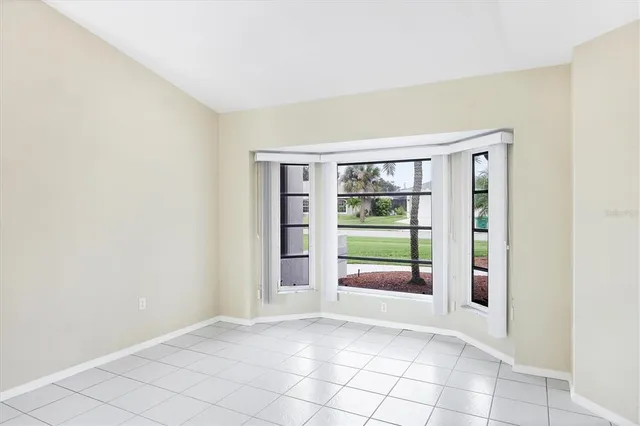 a kitchen with white cabinets a sink and white appliances