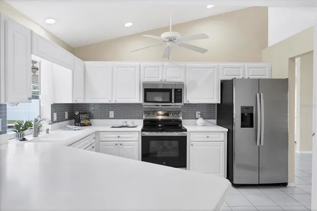 a view of a dining room with furniture wooden floor and next to a window