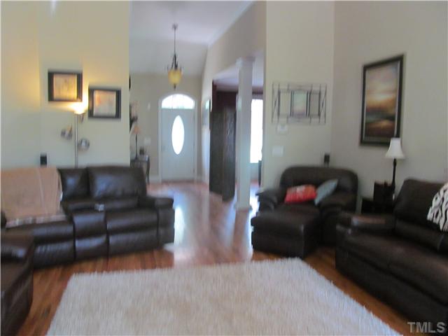 109 Rivers Edge Court Timberlake, NC 27583 - Photo 6 of 18 a living room with furniture and a potted plant