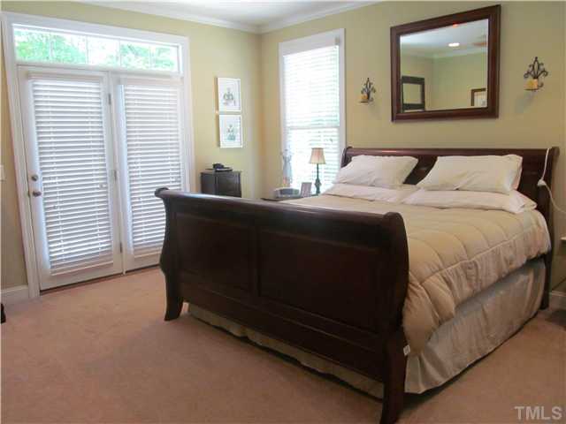 109 Rivers Edge Court Timberlake, NC 27583 - Photo 8 of 18 a bedroom with a bed and a couch