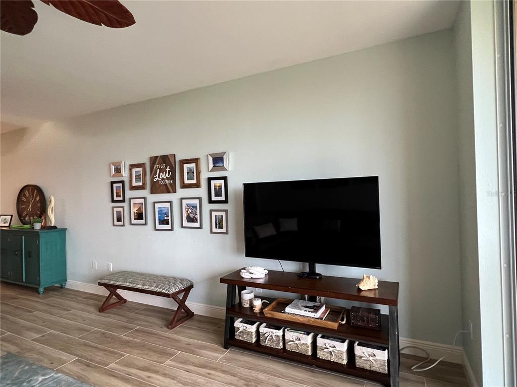 3321 Sunset Key Circle, Unit 308 Punta Gorda, FL 33955 - Photo 15 of 66 a living room with furniture and a flat screen tv