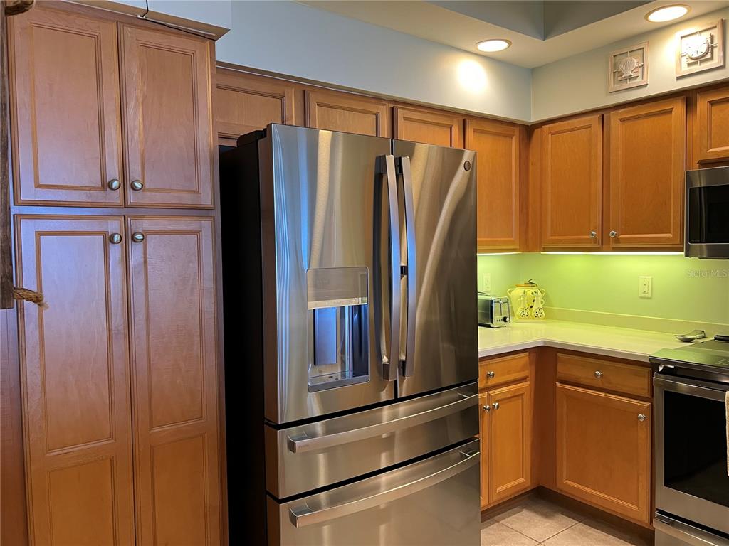 3321 Sunset Key Circle, Unit 308 Punta Gorda, FL 33955 - Photo 20 of 66 a kitchen with stainless steel appliances granite countertop a refrigerator and a sink