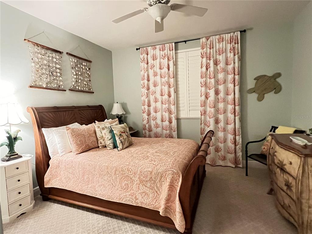 3321 Sunset Key Circle, Unit 308 Punta Gorda, FL 33955 - Photo 33 of 66 a bedroom with a bed and a dresser