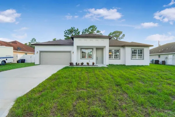 a view of a house with a back yard