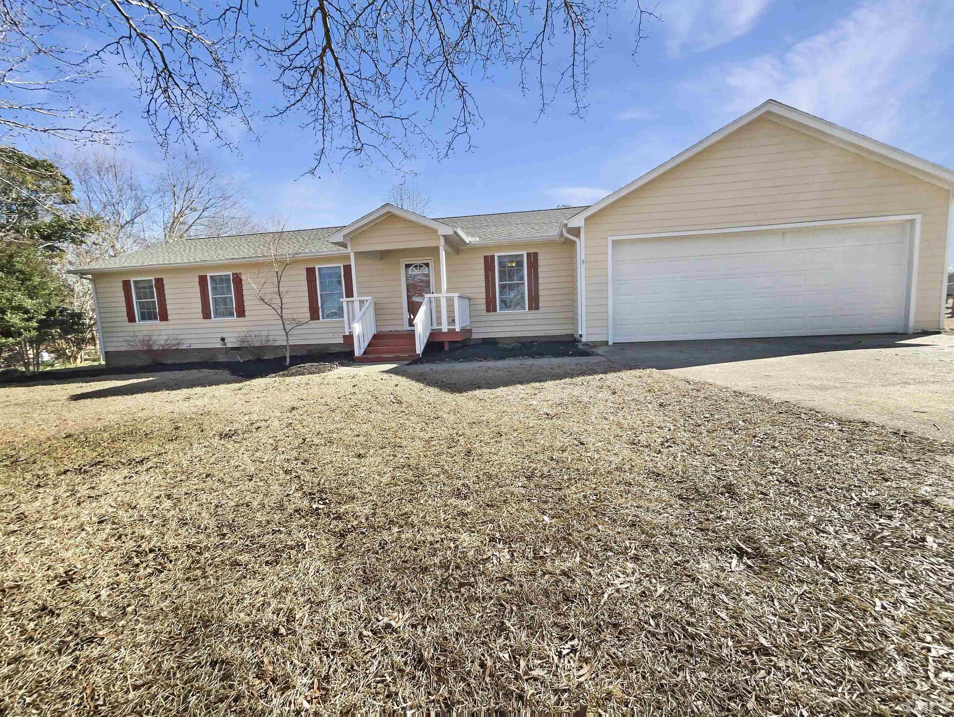 front view of a house with a yard