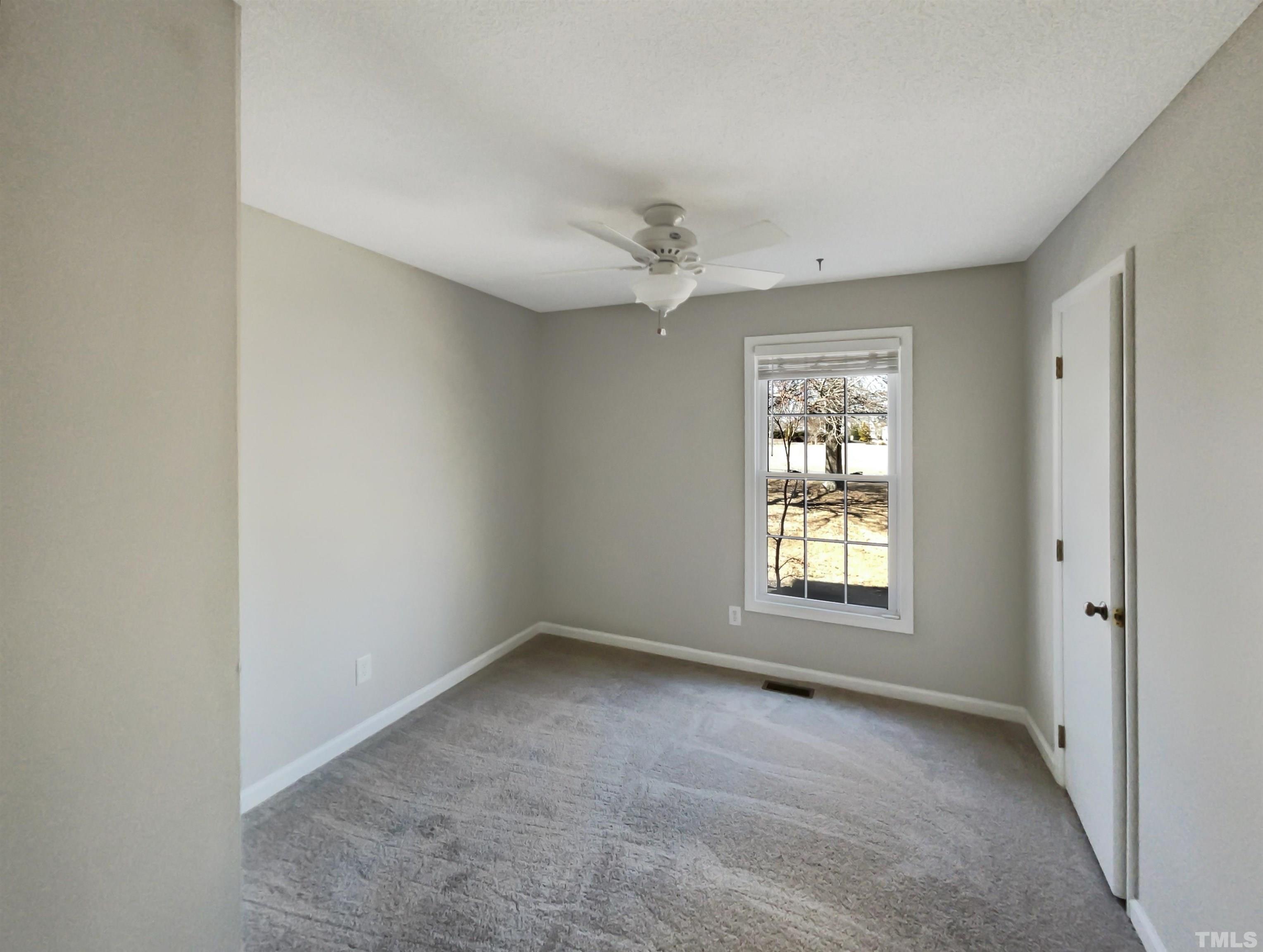 8889 Mt Pleasant Church Road Willow Spring, NC 27592 - Photo 11 of 18 a view of an empty room with a window