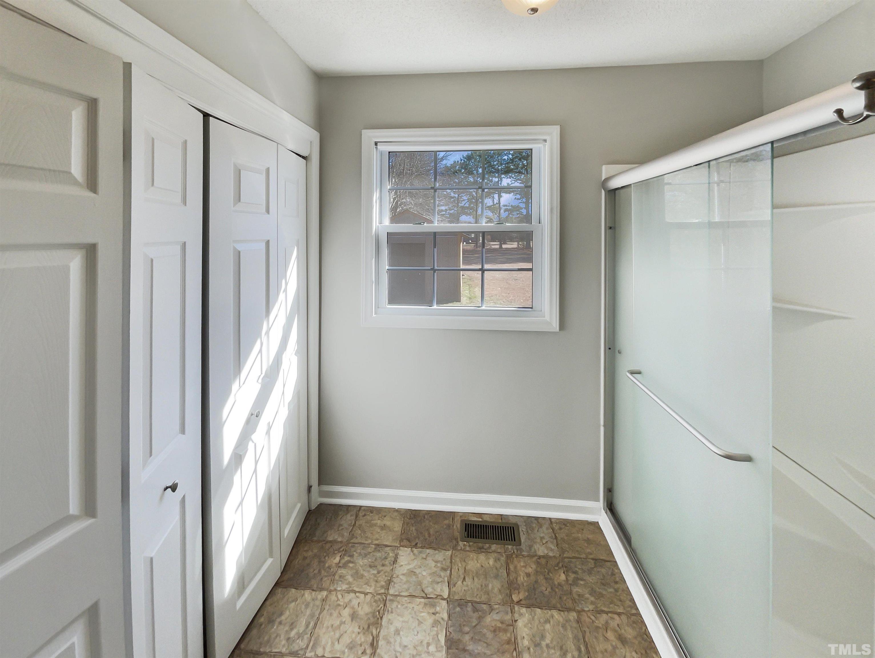 8889 Mt Pleasant Church Road Willow Spring, NC 27592 - Photo 14 of 18 a view of an empty room with a window