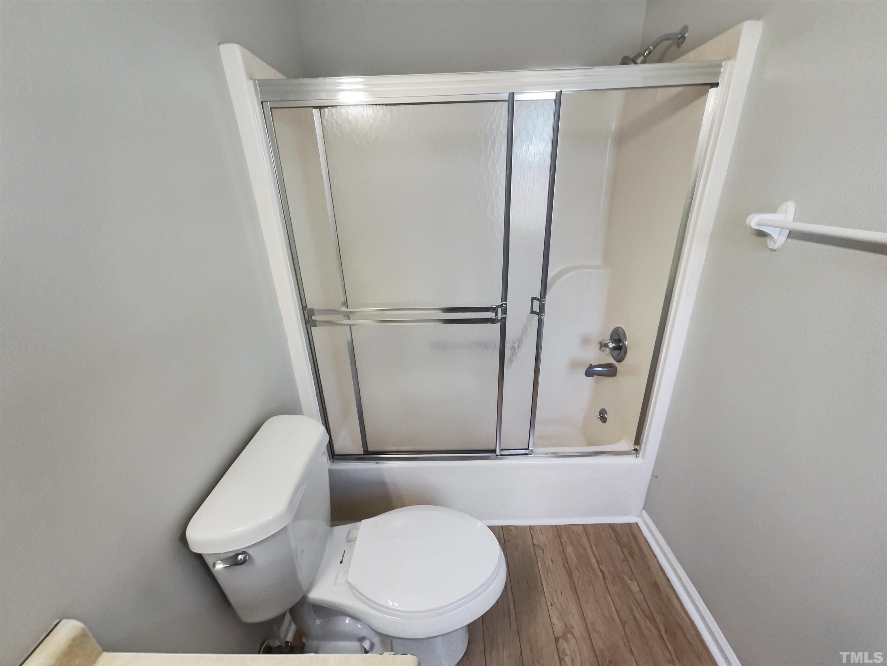 8889 Mt Pleasant Church Road Willow Spring, NC 27592 - Photo 17 of 18 a bathroom with a toilet and a shower