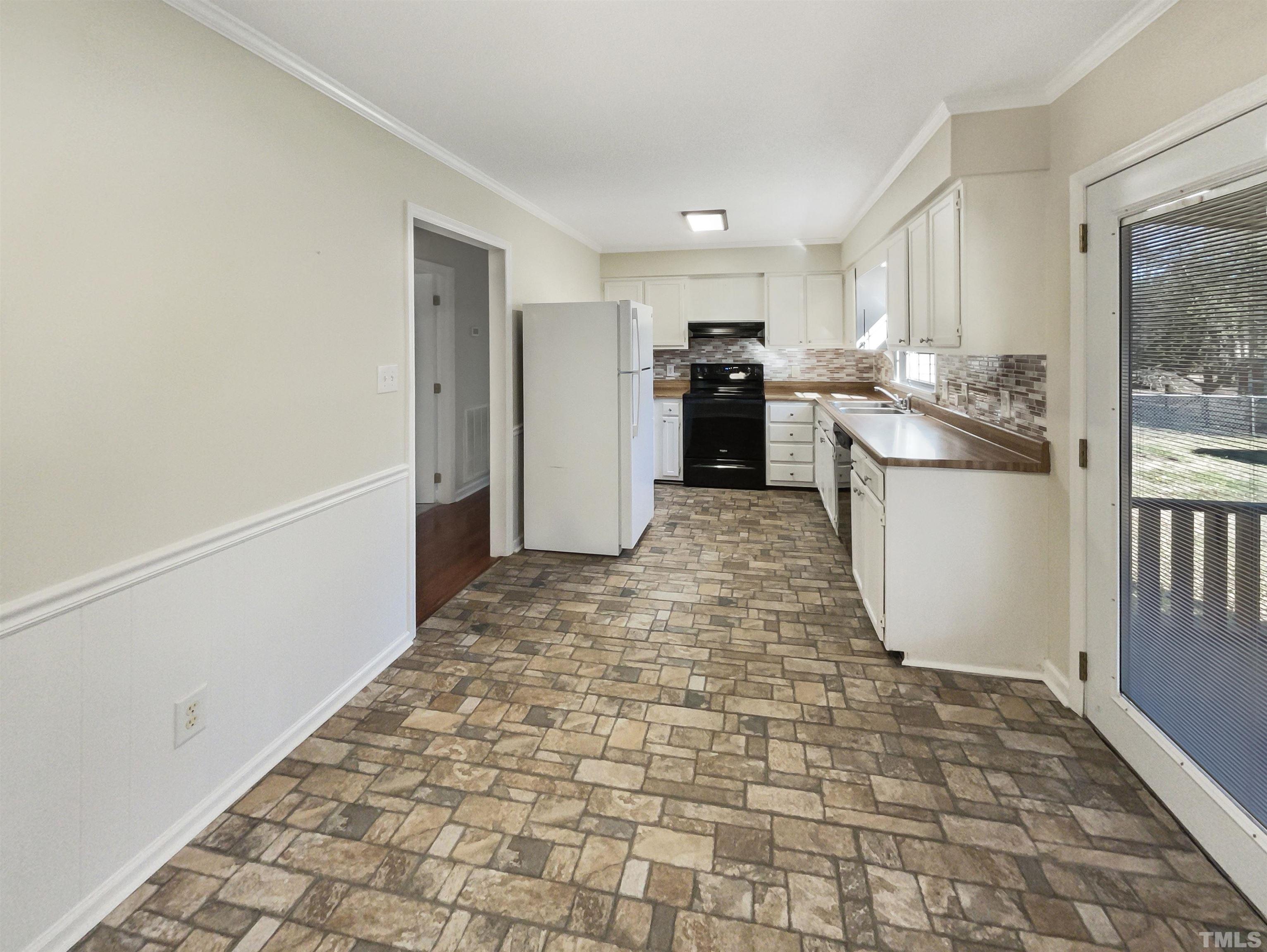 8889 Mt Pleasant Church Road Willow Spring, NC 27592 - Photo 2 of 18 a view of a kitchen with a sink