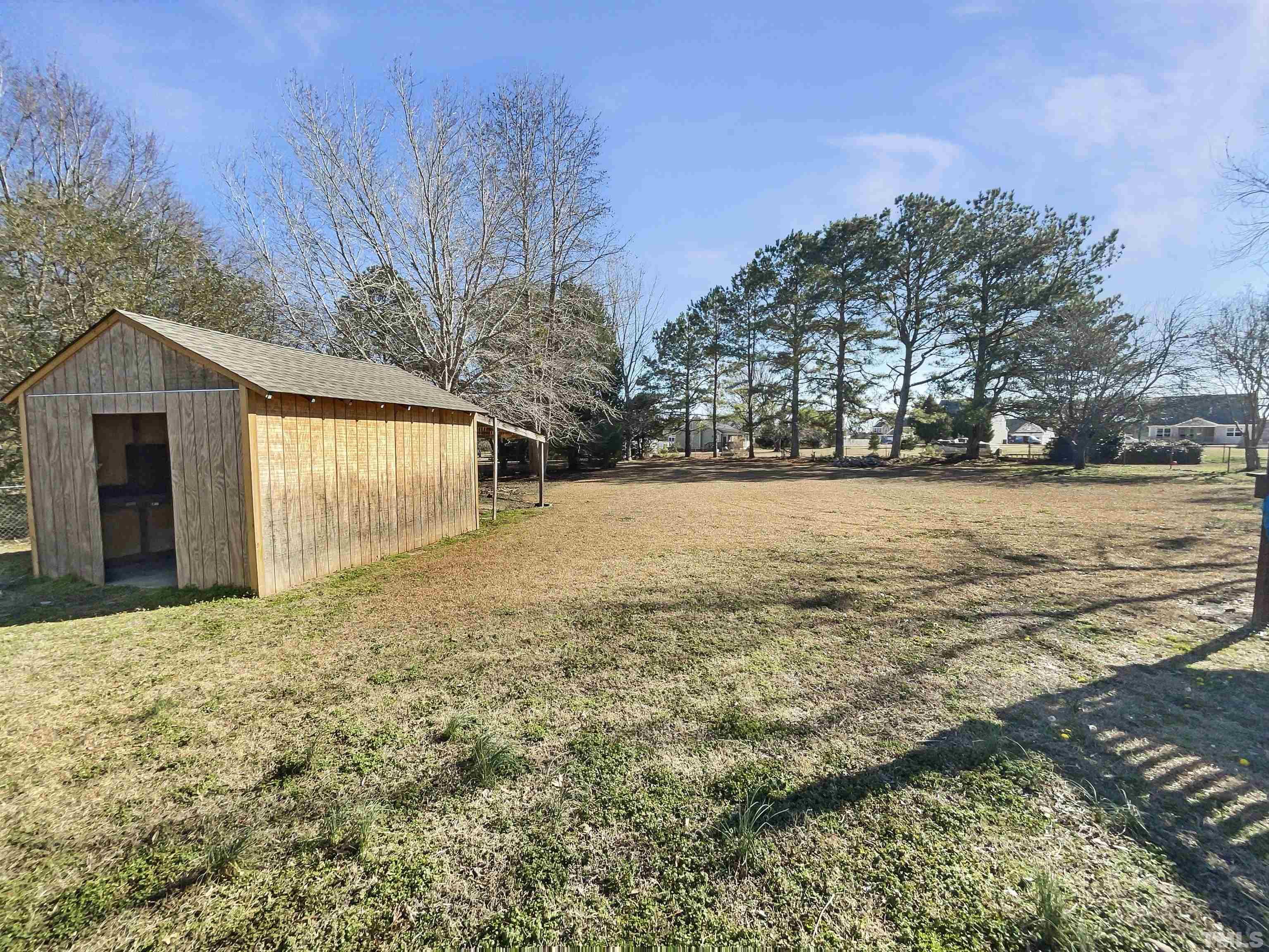 8889 Mt Pleasant Church Road Willow Spring, NC 27592 - Photo 6 of 18 a view of a yard with a house