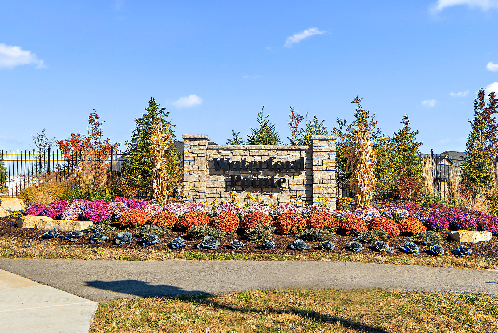 a view of outdoor space with lots of flowers and trees