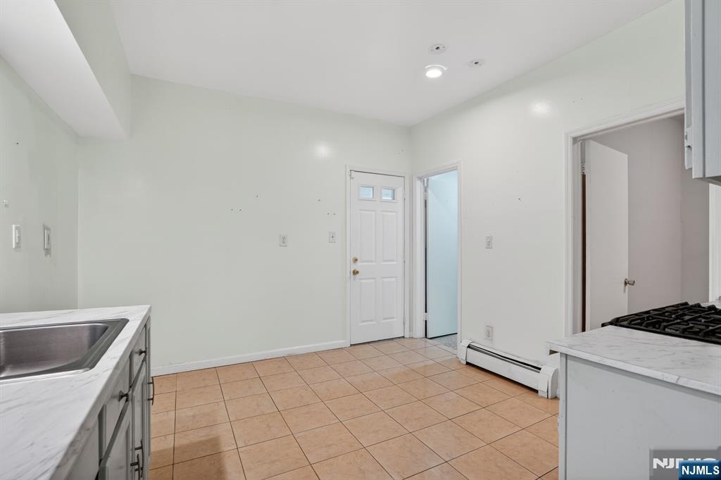 1110 Hampton Place Elizabeth, NJ 07201 - Photo 4 of 23 a view of a kitchen with a sink washer and dryer