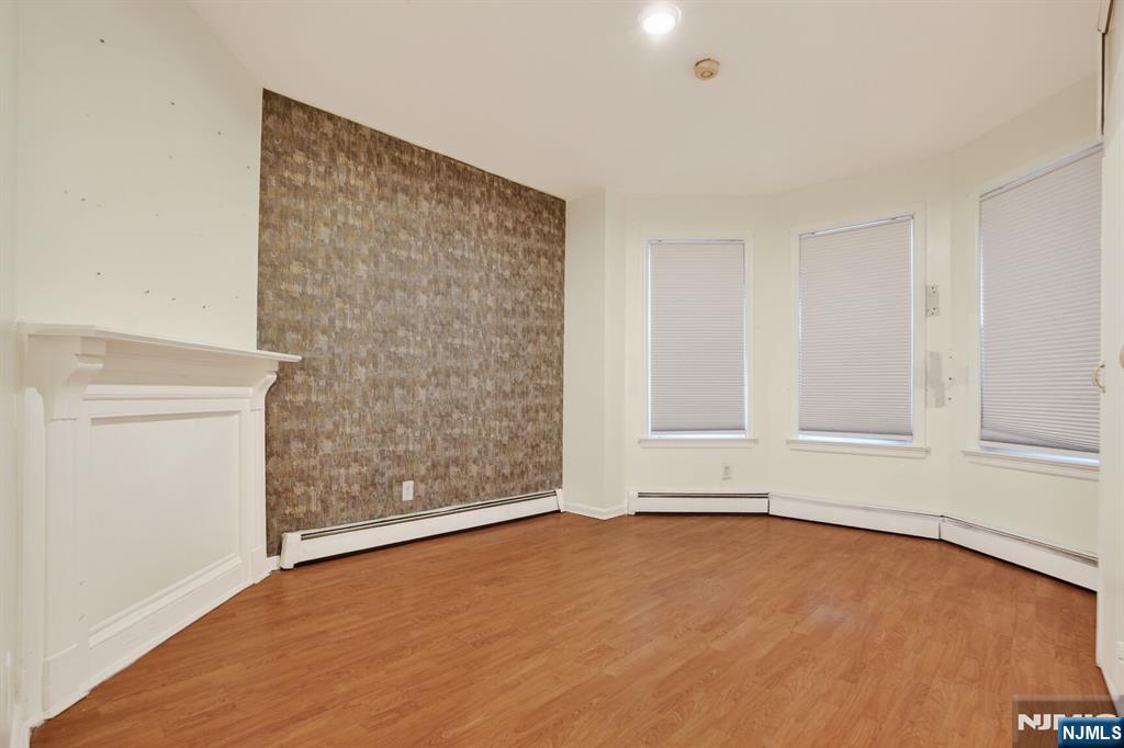 1110 Hampton Place Elizabeth, NJ 07201 - Photo 6 of 23 a view of an empty room with a window