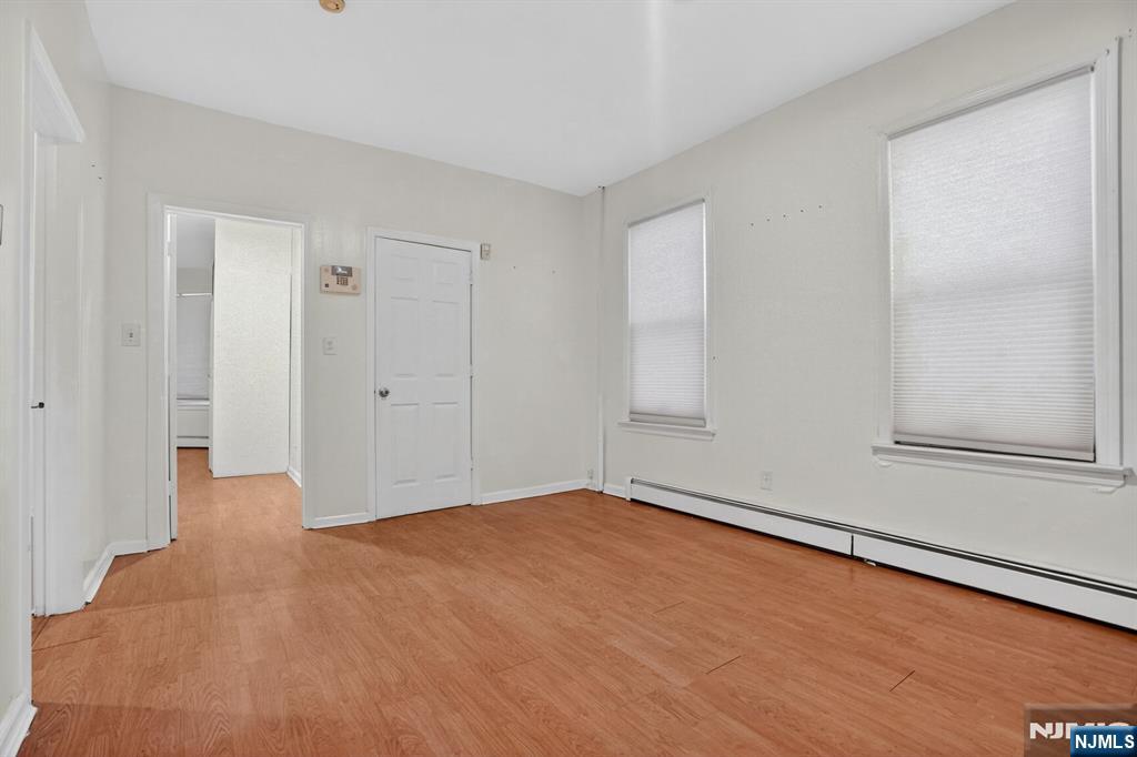 1110 Hampton Place Elizabeth, NJ 07201 - Photo 8 of 23 a view of an empty room with wooden floor